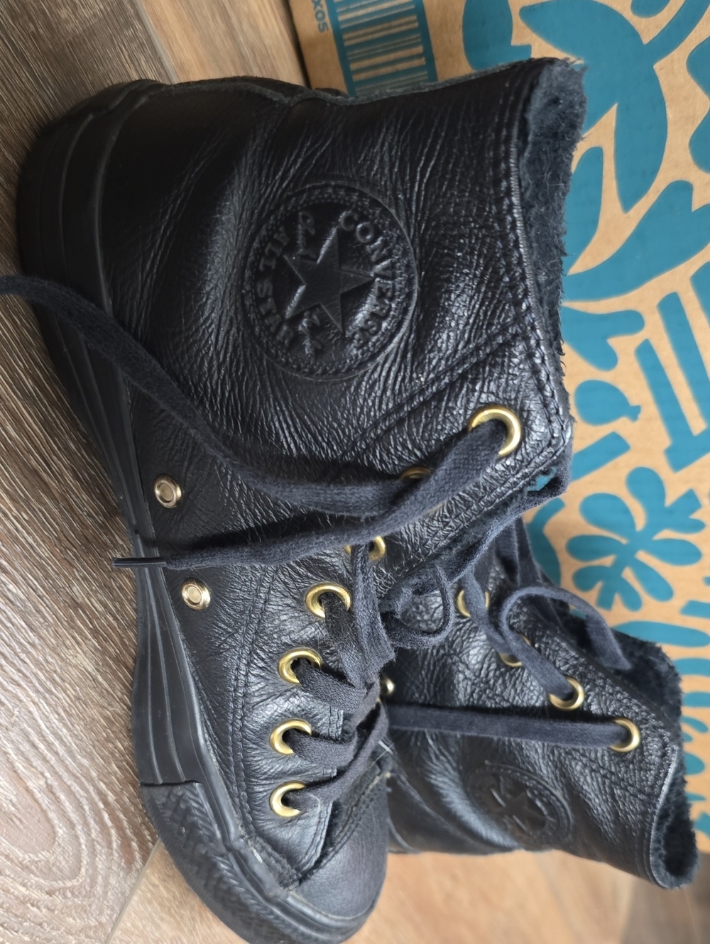Converse Women’s Black Leather High-Top Sneakers with Gold Eyelets